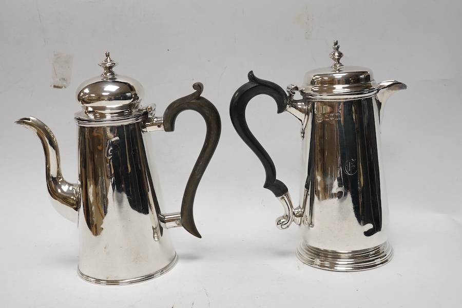 Two Edwardian silver cafe au lait pots, Pearce & Sons, London, 1908 and Nathan & Hayes, Chester, 1905, gross weight 21.1oz. Condition - poor